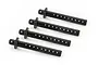 Four black plastic RC car body posts arranged diagonally on a white background.