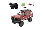 WPL C54-1 1/16 scale red RC rock crawler truck with transmitter, battery, and USB charger on a white background.