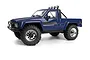 A blue 1/18 scale HPI Venture18 Flux-T 1985 Toyota Hilux SR5 RC rock crawler truck on a white background.