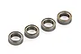 Four metal shielded ball bearings arranged in a diagonal line against a white background.