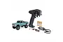 Axial SCX30 Chevrolet K10 RC rock crawler in green, including a Spektrum transmitter, four AA batteries, a LiPo battery, and a USB charger.