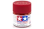 A small glass jar of Tamiya XF-7 Flat Red acrylic paint with a red plastic screw-on lid, set against a plain white background.