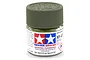 A small glass jar of Tamiya XF-67 Nato Green flat acrylic paint with a green ribbed plastic cap against a white background.