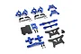 A collection of blue anodized aluminium and carbon fiber RC car upgrade parts including suspension arms, shock towers, and hardware on a white background.