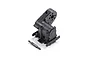 A black plastic RC transmission gearbox assembly and a separate small plastic driveshaft component on a white background.