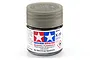 A small glass jar of Tamiya X-19 Smoke gloss acrylic paint with a translucent grey cap, set against a white background.
