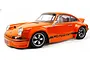 A studio shot of an orange HPI Sport 3 Flux 1973 Porsche 911 Carrera RSR RC car on a white background.
