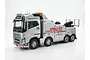A studio shot of the Tamiya Volvo FH16 Globetrotter 750 RC tow truck model, featuring a silver finish with Hall's Truck Rescue branding.