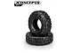 Two JConcepts Megalithic 2.2 inch RC crawler tires stacked on a white background, featuring aggressive tread patterns and embossed sidewall branding.