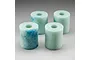 Four cylindrical light green foam air filter elements for RC engines, arranged in a group on a plain grey background.