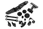 A set of black plastic RC spare parts for the HPI Q32, including gears, suspension arms, and steering components, laid out on a white background.