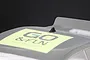A small black shark fin style roof antenna mounted on a clear polycarbonate RC car body shell with a GO & FUN sticker.