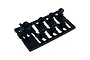 A black plastic sprue containing seven miniature gauge or meter parts for 1/10 scale RC car interior detailing by Pandora RC.