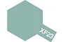 A hexagonal swatch of Tamiya XF-23 Light Blue paint with the code XF23 printed in white on a small tab extending from the bottom right.