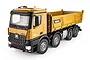 A studio shot of a yellow HuiNa 1536 RC dump truck on a white background, showing detailed cab, bed, and wheels.