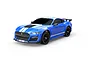 A studio shot of a blue 1/10 scale MJX RC Ford Mustang Shelby GT500 remote control car with white racing stripes on a white background.