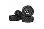 A set of four Pro-Line 1/16 Badlands MX RC tyres pre-mounted on black Split Six rims, shown stacked against a white background.