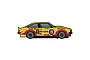 Side profile of a yellow and red Scalextric 1/32 scale Holden A9X Torana slot car, race number 19, featuring various sponsor decals.