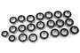 A collection of various sized metal ball bearings with black rubber seals arranged on a white background.
