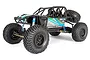 Axial RR10 Bomber 1/10 scale RC rock racer truck with black roll cage, blue shocks, and BFGoodrich tires on a white background.