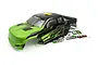 A pre-painted green and black RC truck body shell for the BlackZon Smyter MT, shown with a matching decal sheet on a white background.