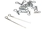 A collection of silver metal RC body clips and two long body pins scattered on a white background.
