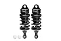 Two black GPM Racing aluminium adjustable RC shock absorbers with white plastic ball ends on a white background.