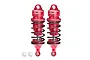 Two red GPM Racing aluminium adjustable RC shock absorbers with black springs and two small white plastic pivot balls on a white background.