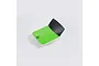 A green and black foam battery hatch cover for an FMS RC plane against a plain white background.