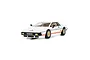 A 1/32 scale Scalextric James Bond Lotus Esprit Turbo slot car in white with orange stripes and gold wheels.