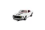 A 1/32 scale Scalextric Ford Mustang slot car in white with black racing stripes, featuring yellow fog lights and a detailed red interior.
