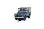 Scalextric 1/32 scale Land Rover Series 1 slot car in RAF blue with a green canvas roof, shown on a slot car track.