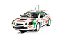 Scalextric 1/32 scale Toyota Celica GT-Four rally slot car in white, green, and red Castrol livery on a track.