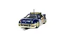 A Scalextric 1/32 scale Ford RS200 slot car in blue and cream livery with Q8 Oils branding, positioned on a slot car track.