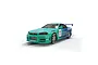 Scalextric 1/32 scale Nissan R34 Skyline GTR slot car featuring the iconic Falken Tyres teal and blue racing livery with number 1 on the side.