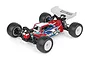 A studio shot of a Team Associated RC10T84 1/10 scale 4WD electric RC truggy, featuring a red, white, and blue painted body and black off-road tires.