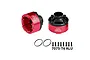 Two red and black GPM Racing differential cases with O-rings and screws on a white background.