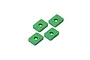Four small, rectangular green anodized aluminium spacers with a central hole, arranged on a white background.