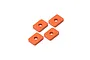 Four orange anodized aluminium rectangular differential gear spacers arranged on a white background.