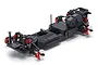 A studio shot of the Kyosho Fazer D2 RC drift car chassis, featuring a black plastic frame with red anodized aluminum suspension components.