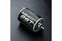 An MST M54 540-size 26-turn brushed RC motor shown at an angle on a black textured surface.