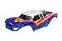 Traxxas 1/10 scale Bigfoot RC truck body shell featuring a red, white, and blue patriotic paint scheme with star decals and Firestone branding.