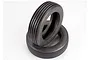 Two black rubber RC monster buggy front tyres with a ribbed tread pattern stacked on a white background.