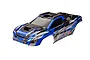 A blue and black pre-painted clipless body shell for the Traxxas XRT RC truggy, featuring aggressive styling and XRT branding.