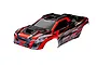 Traxxas 1/6 XRT clipless painted body shell in red, black, and grey with XRT branding.