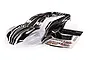 Traxxas Rustler 4X4 ProGraphix body shell in black and clear, accompanied by a decal sheet on a white background.