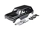 A black Traxxas 1/10 scale Chevrolet Blazer RC body shell with chrome bumpers and black plastic mounting accessories on a white background.