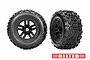 Two Traxxas 3.8 inch Sledgehammer belted RC truck tires mounted on black rims, shown from front and angled perspectives against a white background.