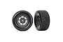 Two Traxxas 1/10 scale RC front wheels with Hoosier branded tires and grey dirt oval rims, shown from side and front angles.