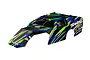 Traxxas Slash modified clipless RC body shell in green, blue, and black racing livery with sponsor decals on a white background.